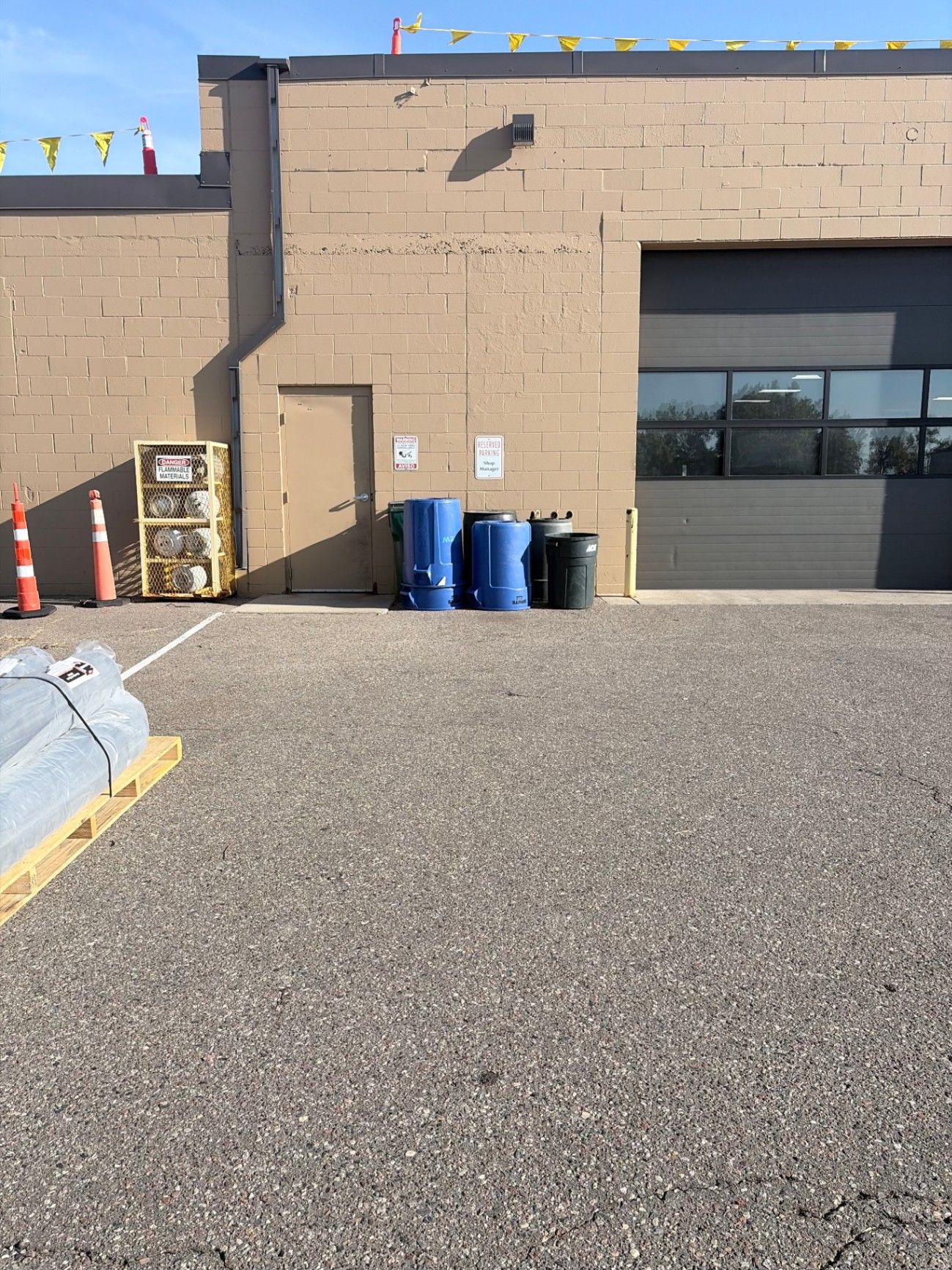 Commercial exterior painting prep at the Brightview Building in Plymouth, MN, with materials staged along the wall