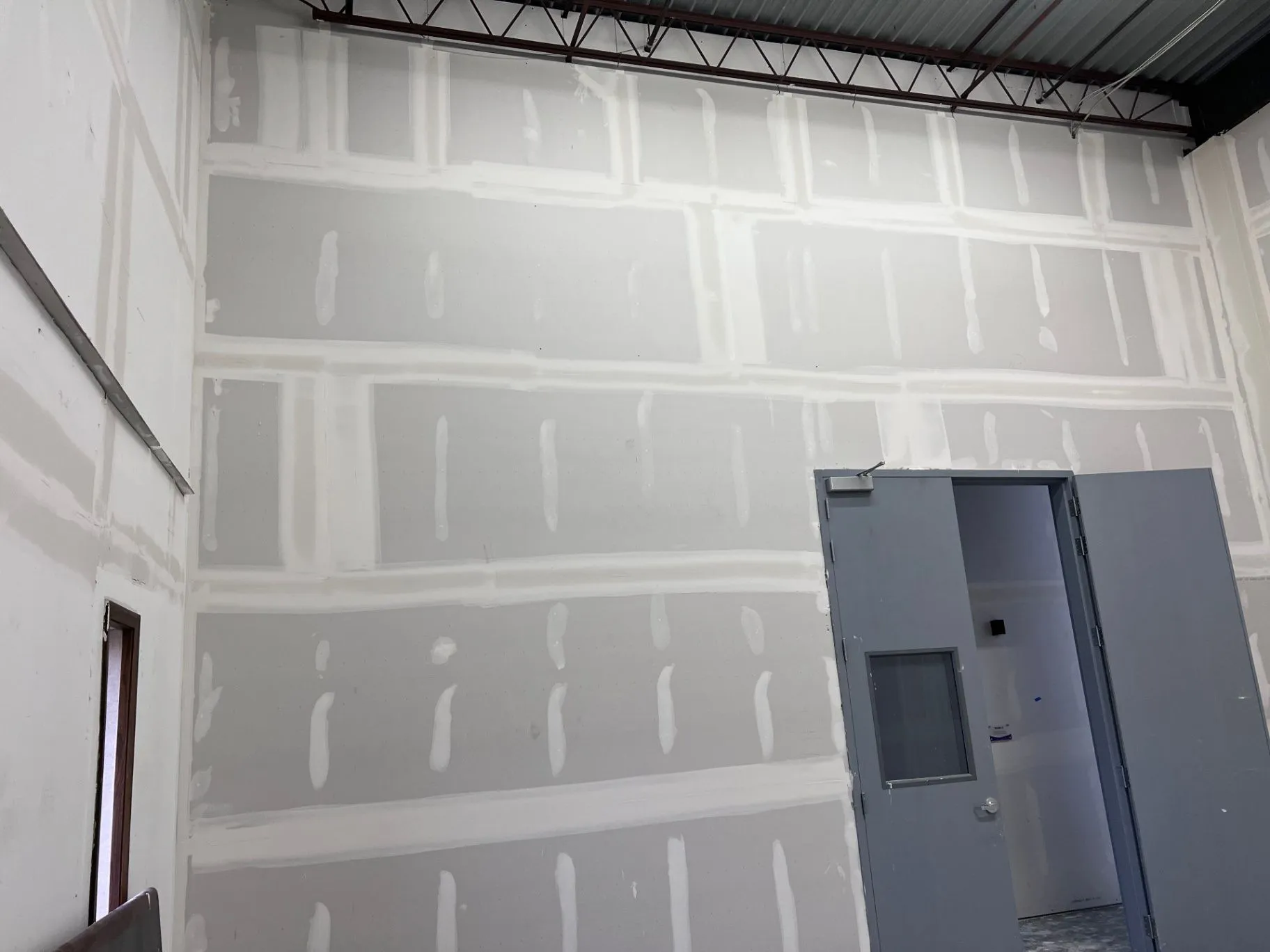 Commercial drywall seams being finished in Eden Prairie, MN