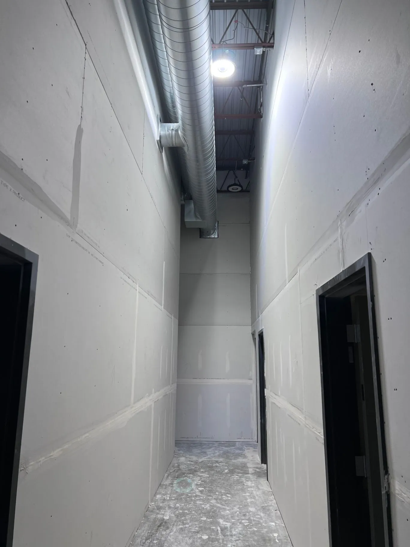 Taped and mudded drywall walls in a commercial building in Eden Prairie, MN