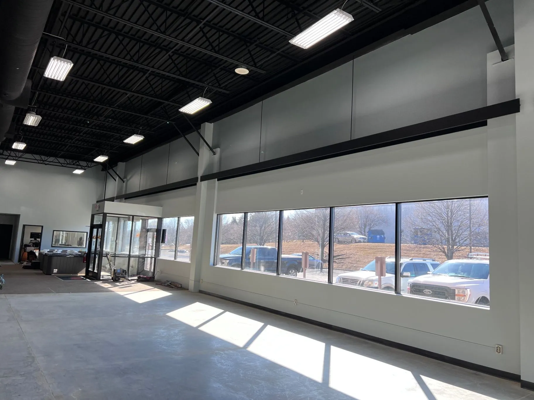 Completed interior paint finish and black ceiling at a showroom in Plymouth, MN