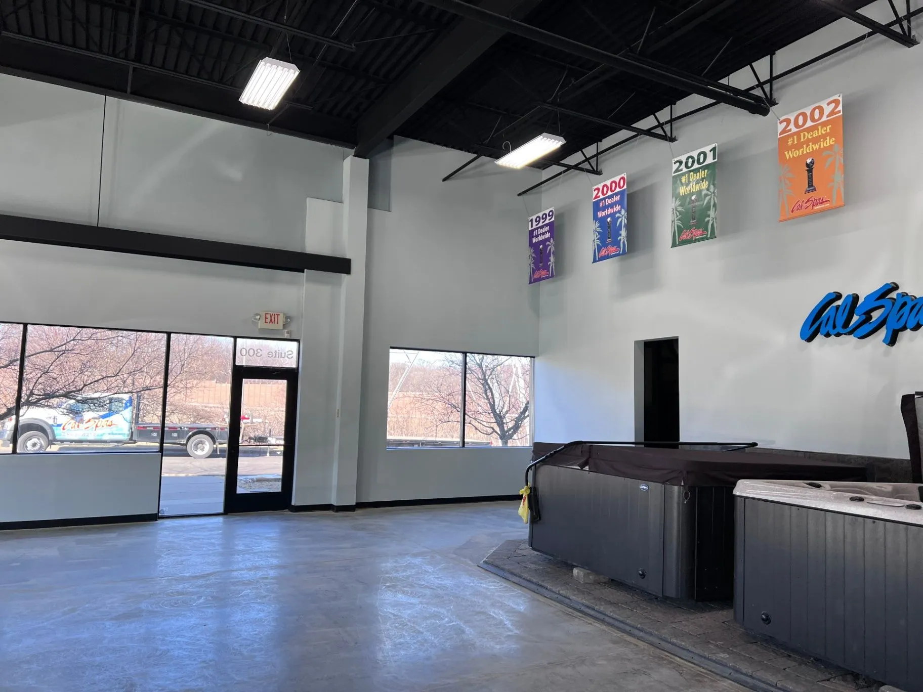 Completed high ceiling and wall paint finish in a Plymouth, MN showroom