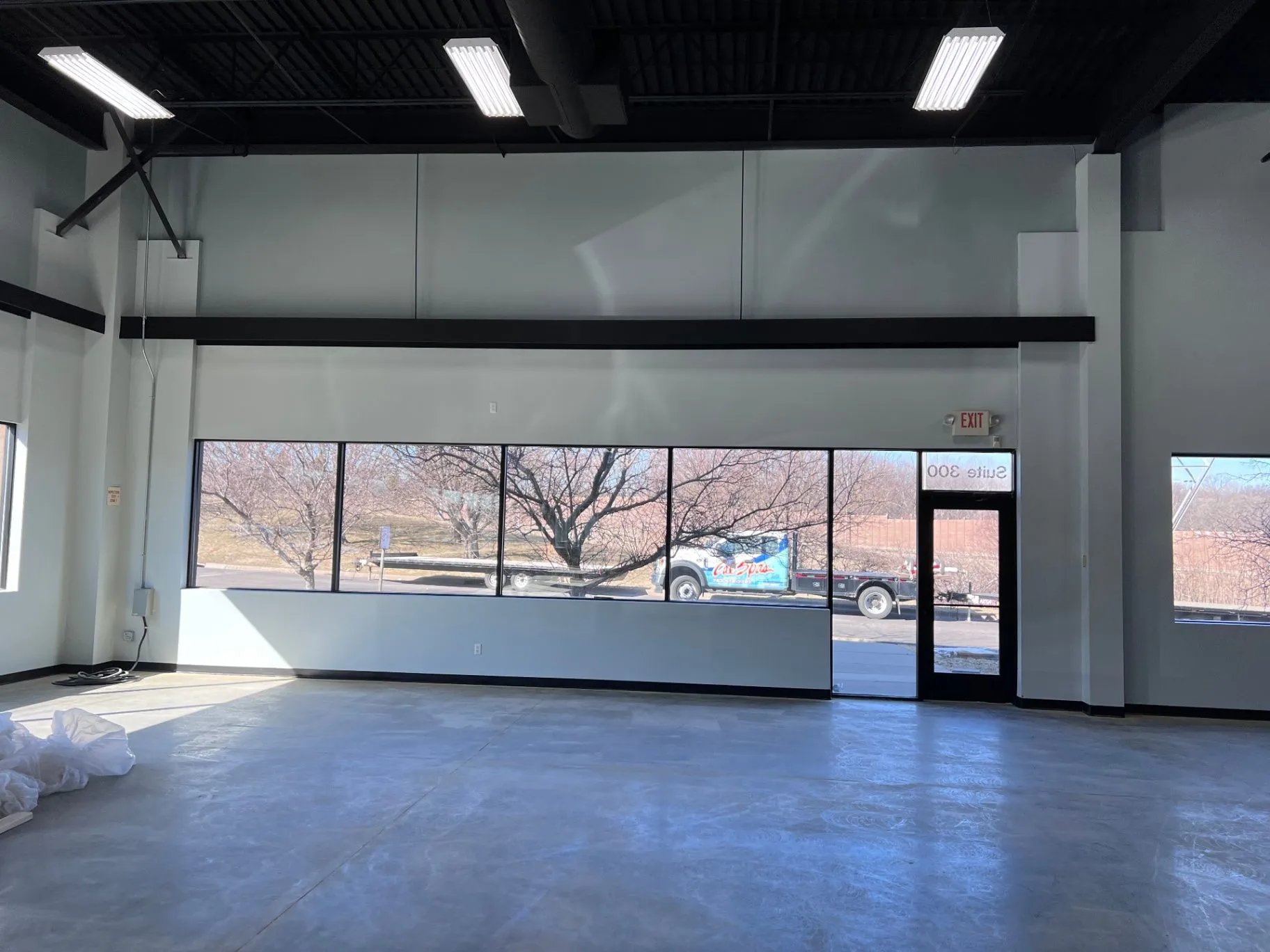 Finished painted walls and black ceiling at the Cal Spas showroom in Plymouth, MN