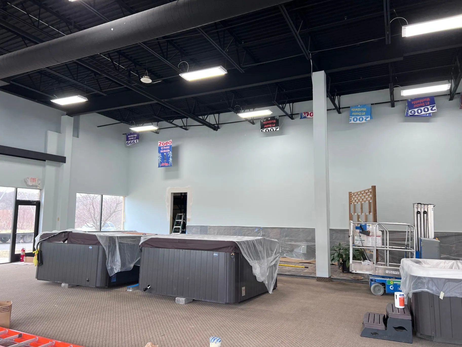 Interior wall and ceiling painting in progress at a commercial showroom in Plymouth, MN