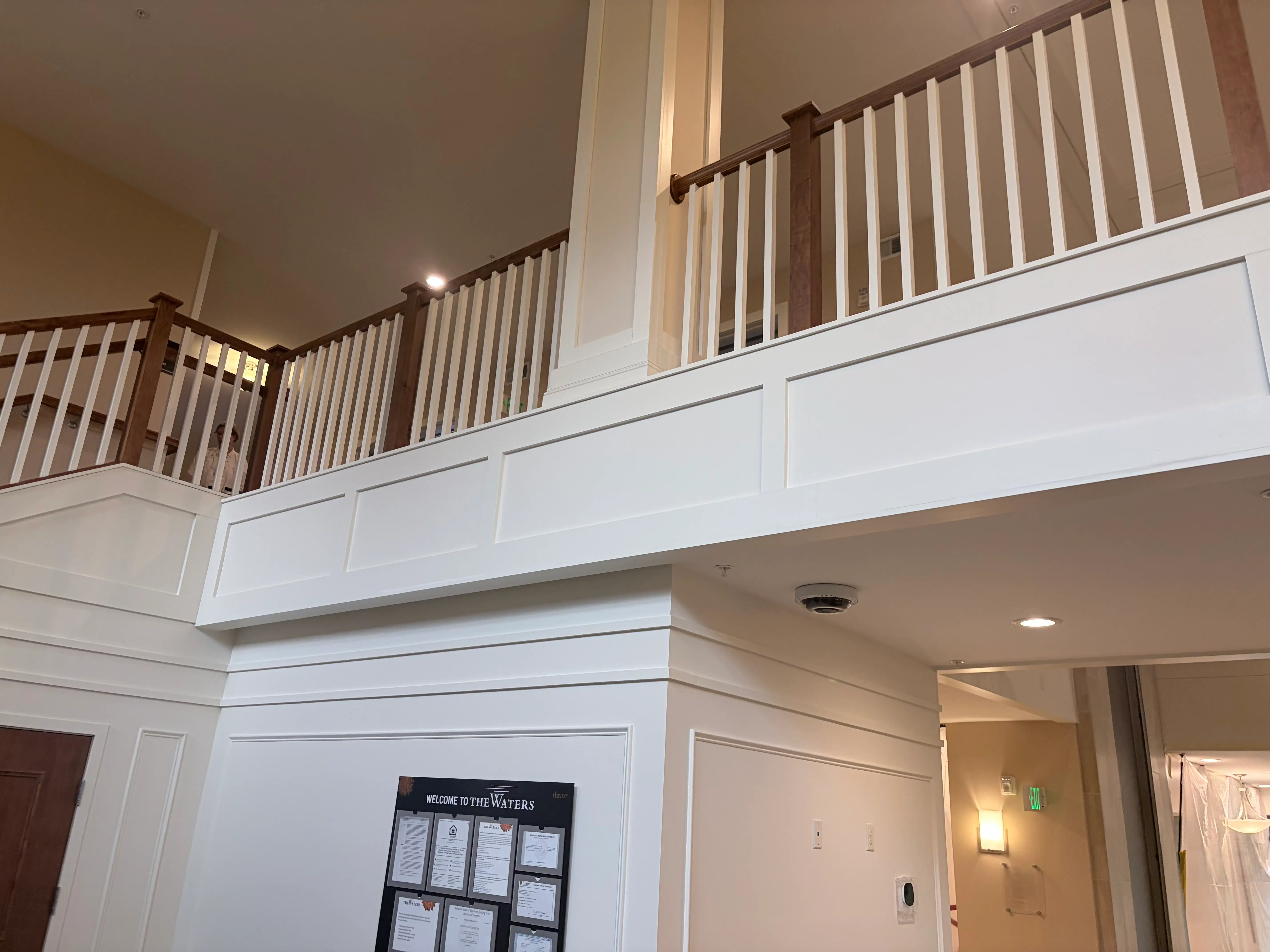 Finished wood railings and painted architectural paneling at The Waters of Edina in Edina, MN