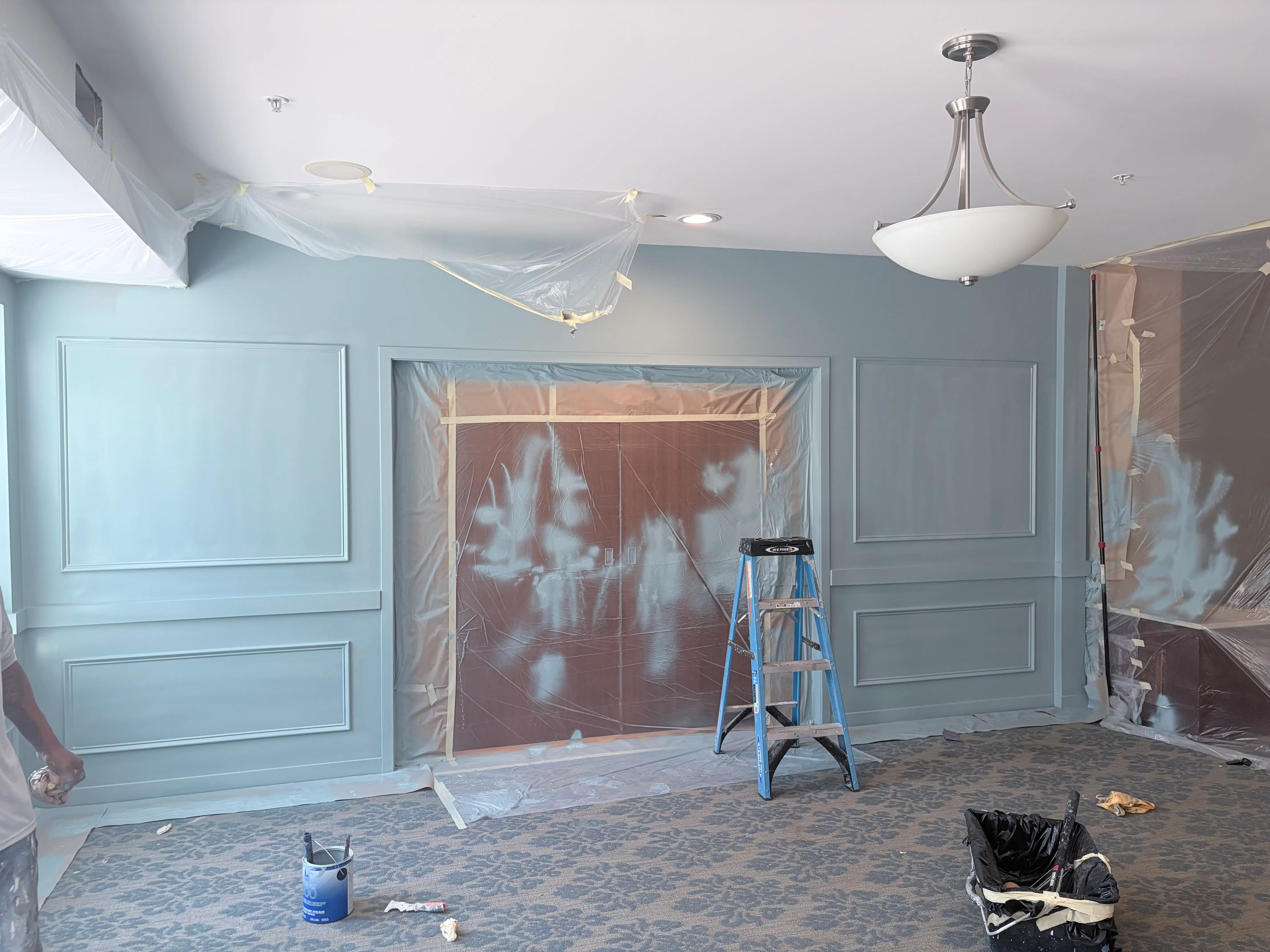 Walls protected during interior painting and paneling work at The Waters of Edina senior living community in Edina, MN